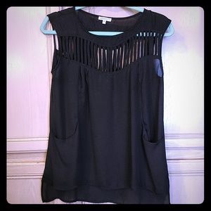 Sheer black top with vertical cut outs and pockets